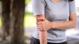 female with painful tennis elbow