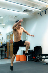 an muscular athlete doing bounding exercise in sportential training studio and clinic