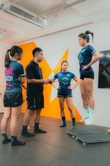 the rugby team athletes are doing the jumping performance assessment with force plate in sportential training studio and clinic