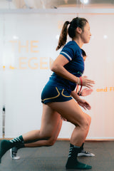 two female athletes are doing high knee exercise during S&C training session in sportential training studio