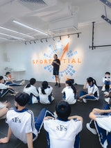 trainer of sportential is doing a sharing workshop to a group of secondary school students for career planning